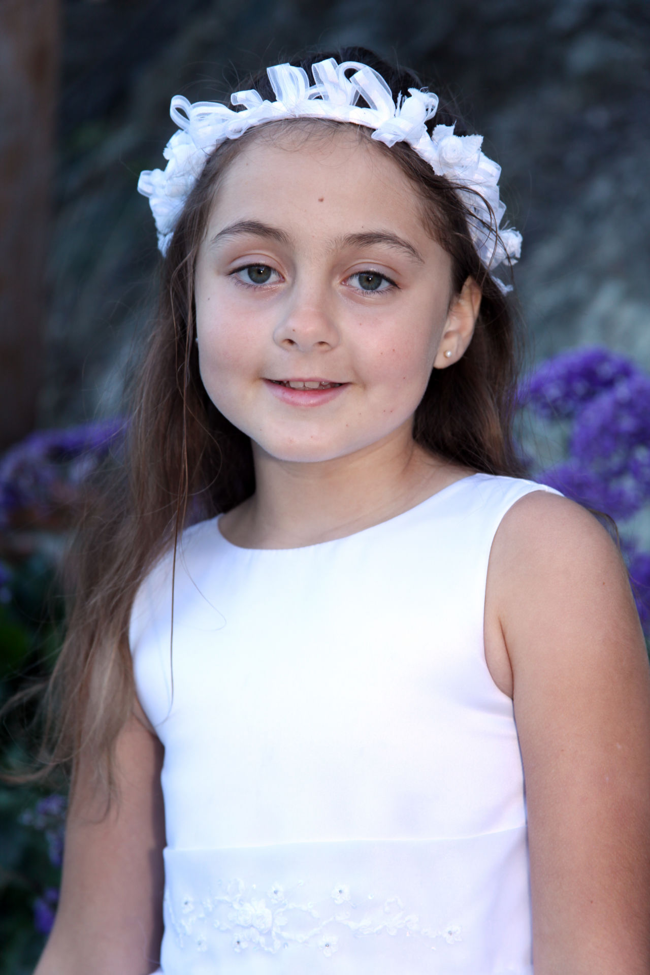 A First Communion portrait marks the important occasion.